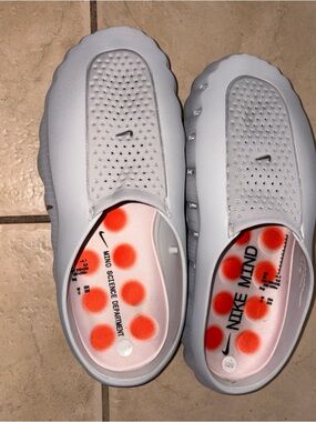 Nike white perforated slip-on clogs with orange polka-dot insoles
